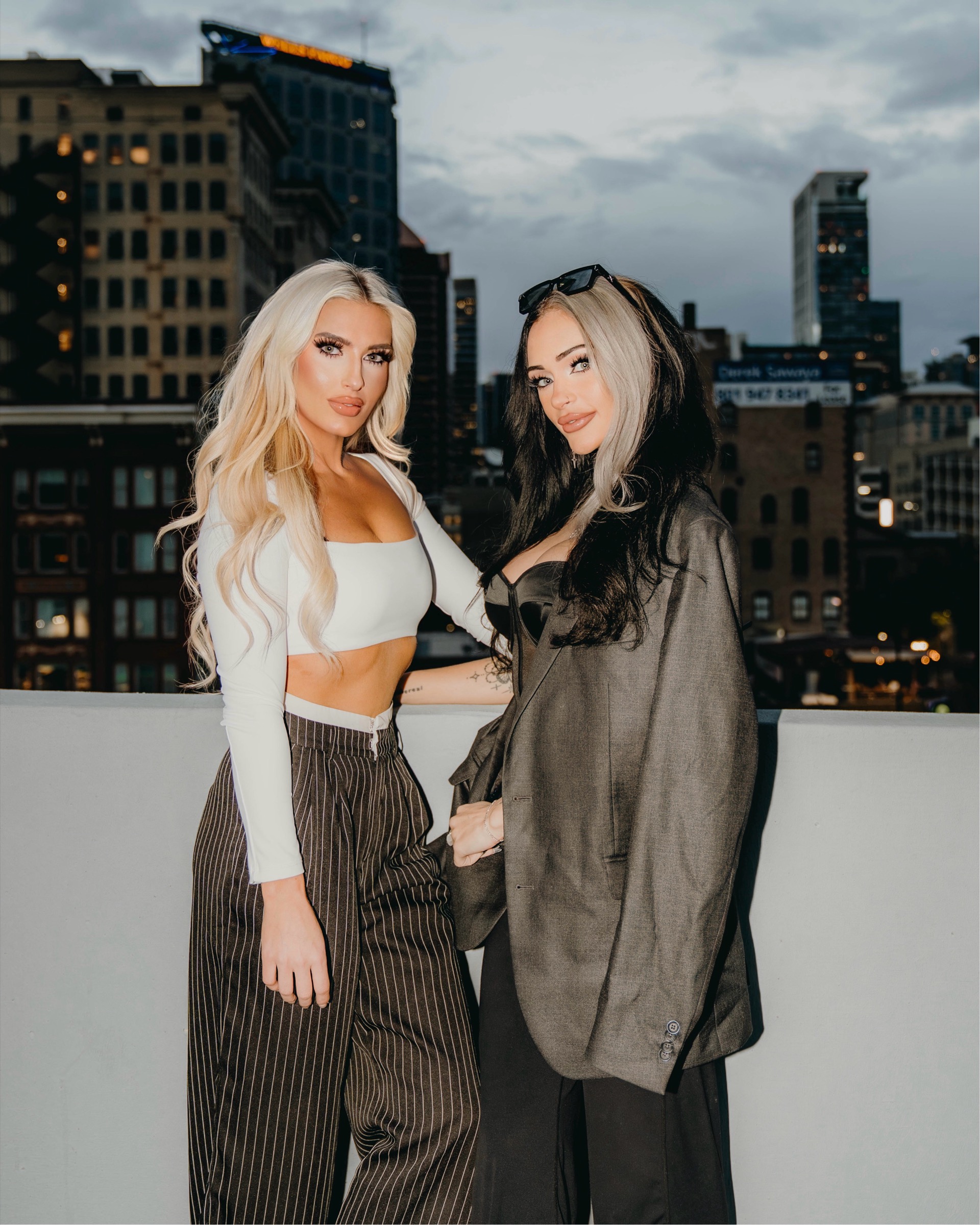 Blaire and Mae in tailored rooftop looks