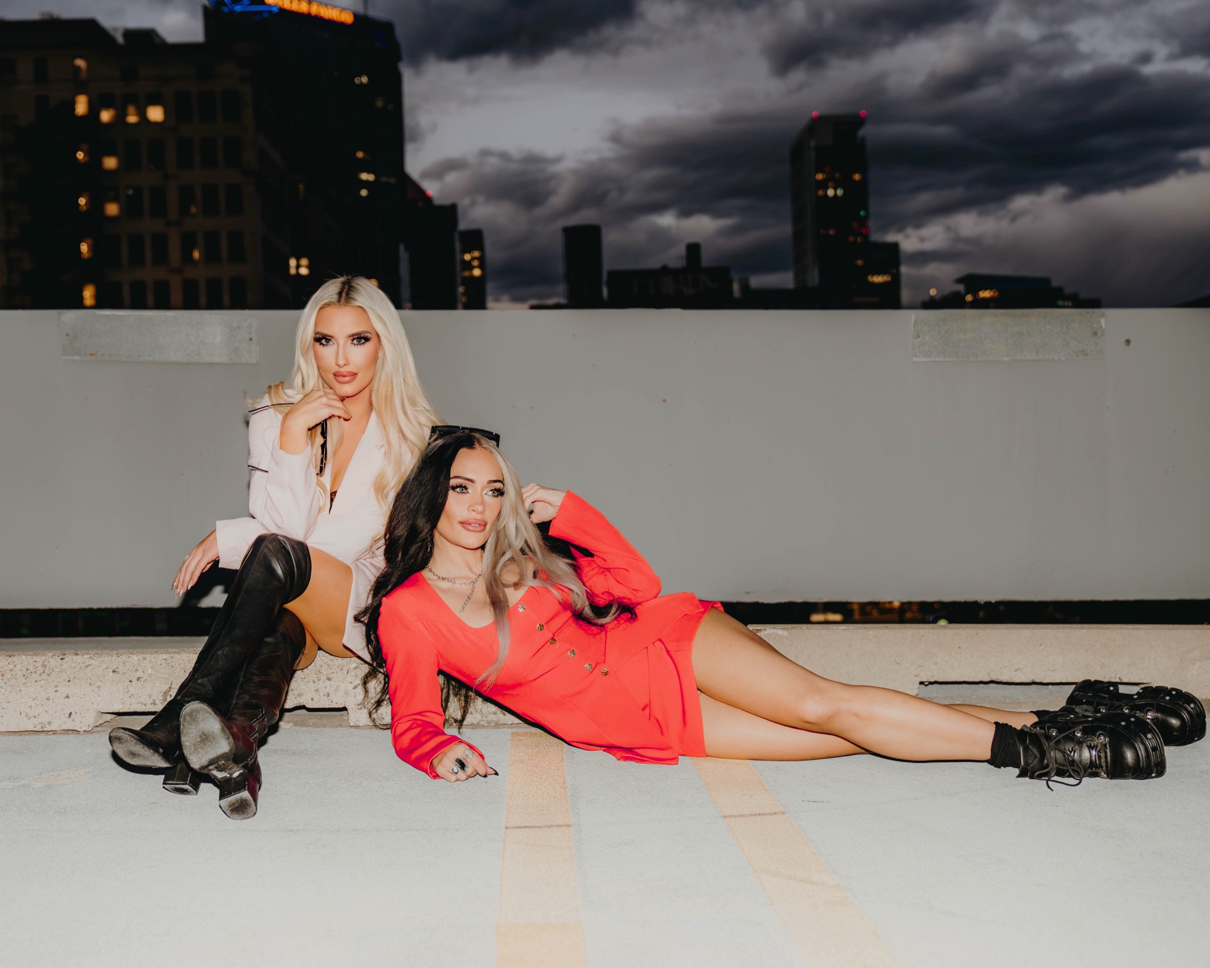 Blaire Thomas and Mae Starks posing on a rooftop at night